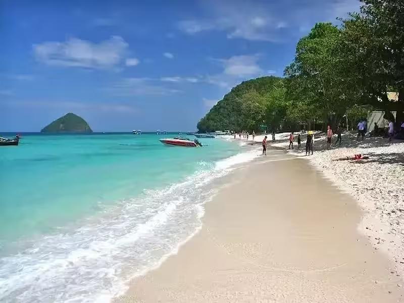 Relaxing on the beautiful white sand beach at Coral Island Phuket