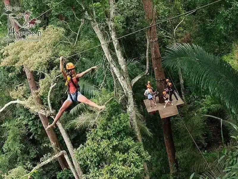 Guest experiencing the exciting roller zipline feature at Hanuman World Phuket