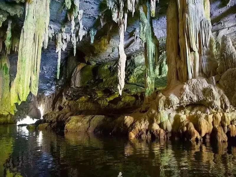 Entrance to a dramatic limestone cave, known as the Bat Cave, on a James Bond Island canoeing tour.