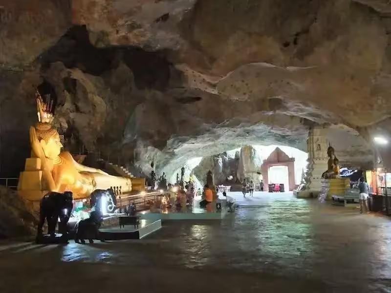 The large golden reclining Buddha statue inside the Suwankuha Temple (Monkey Cave), Phang Nga.