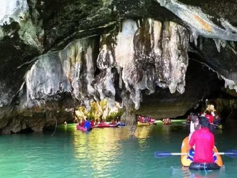 Guided sea canoe entering a hidden 'hong' sea cave on John Gray's Hong by Starlight tour