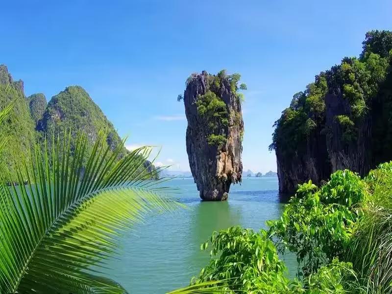 James Bond Island and Phi Phi combo tour speedboat passing limestone cliffs