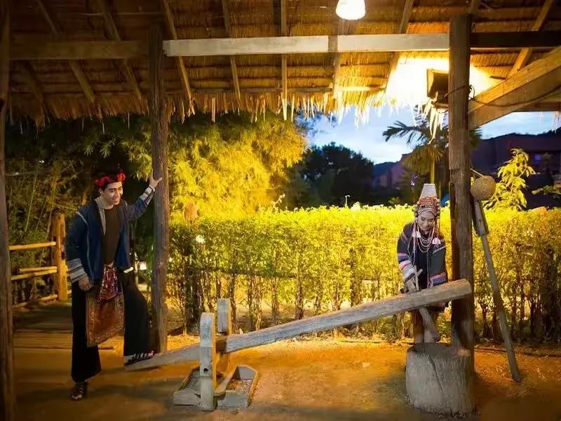 Visitors exploring the traditional Thai village at Siam Niramit Phuket