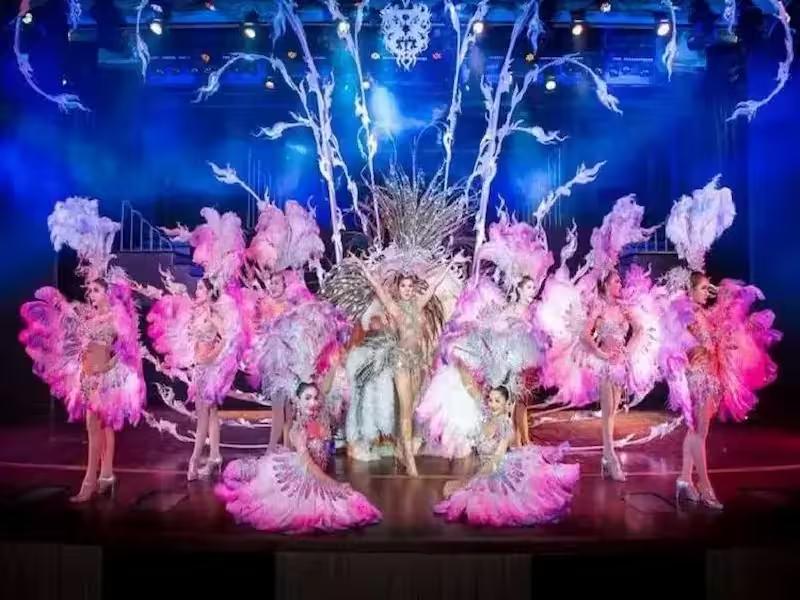 Cast of showgirls performing a musical number on the Simon Cabaret stage